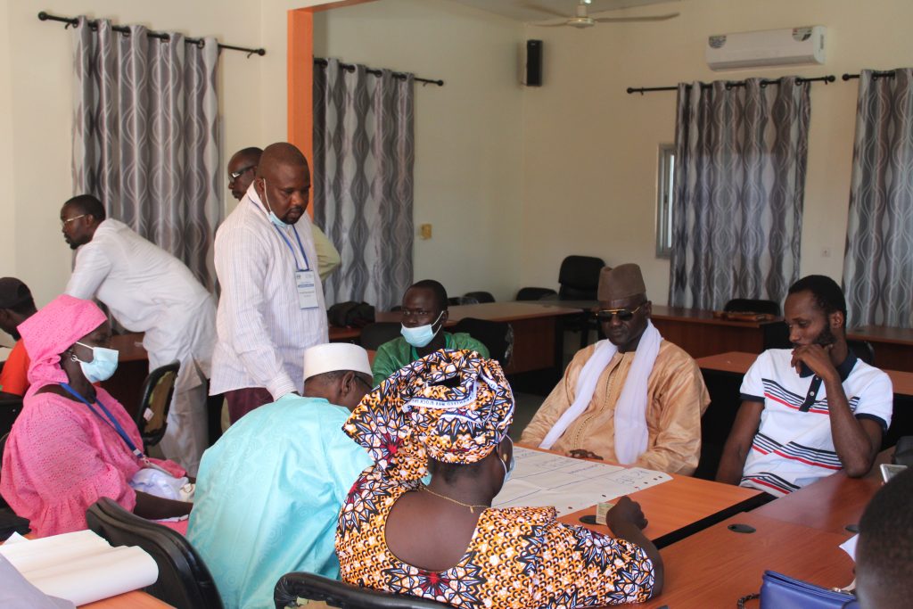 Community members participating in Flood Resilience Measurement for Communities results sharing session in Thiès, Senegal.