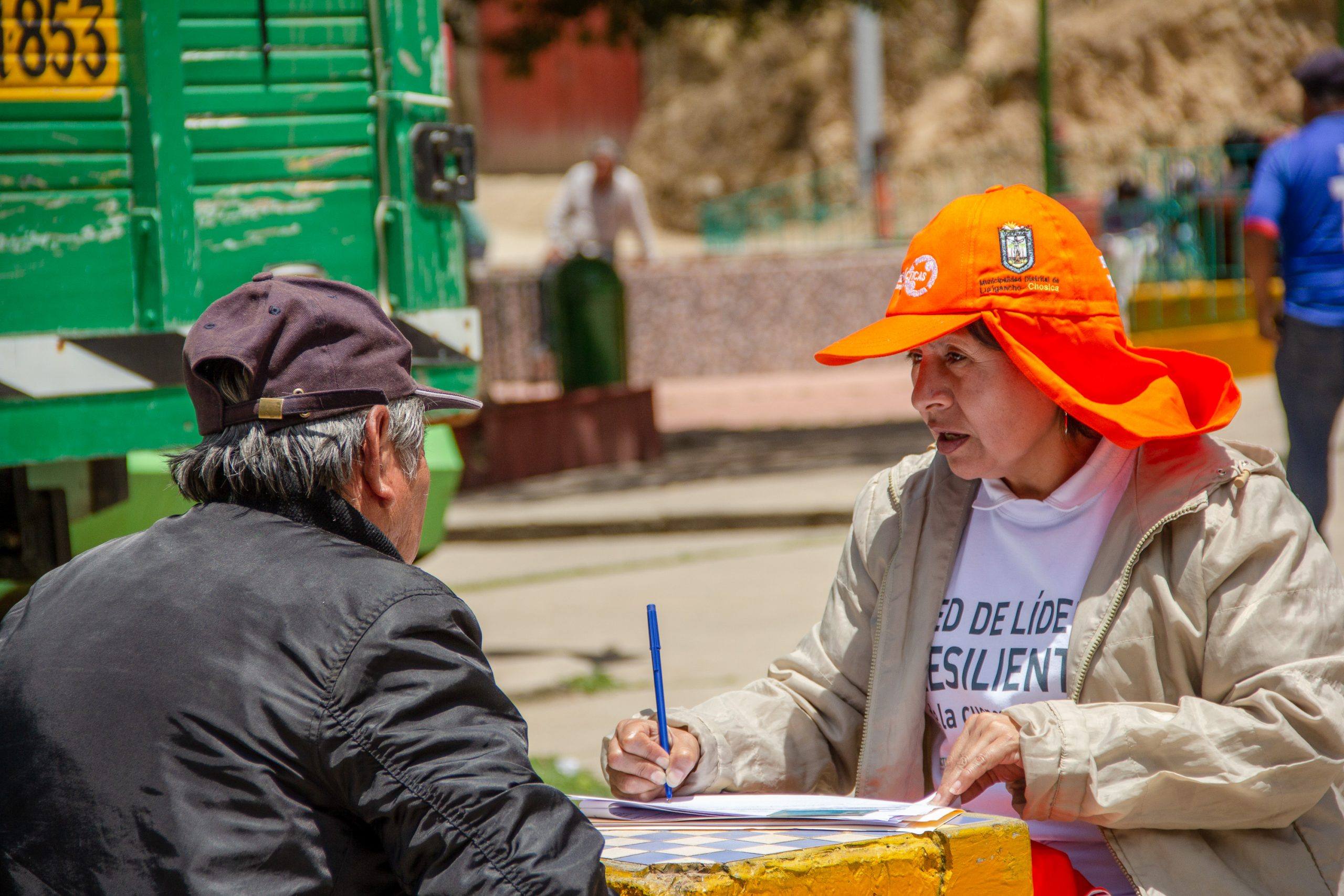 Eva, a member of a local partnering organisation, interviewing community member as part of Practical Action's FRMC data gathering. Photo: Giorgio Madueno, Practical Action.