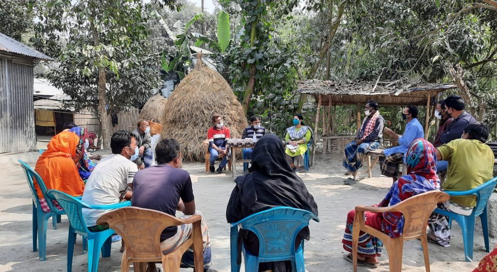 Meeting with members of Community Flood Resilience Action Group, Char Charitabari, Sundarganj. Community groups shared their experience and challenges in building community flood resilience. (Zakia in yellow with blue mask)