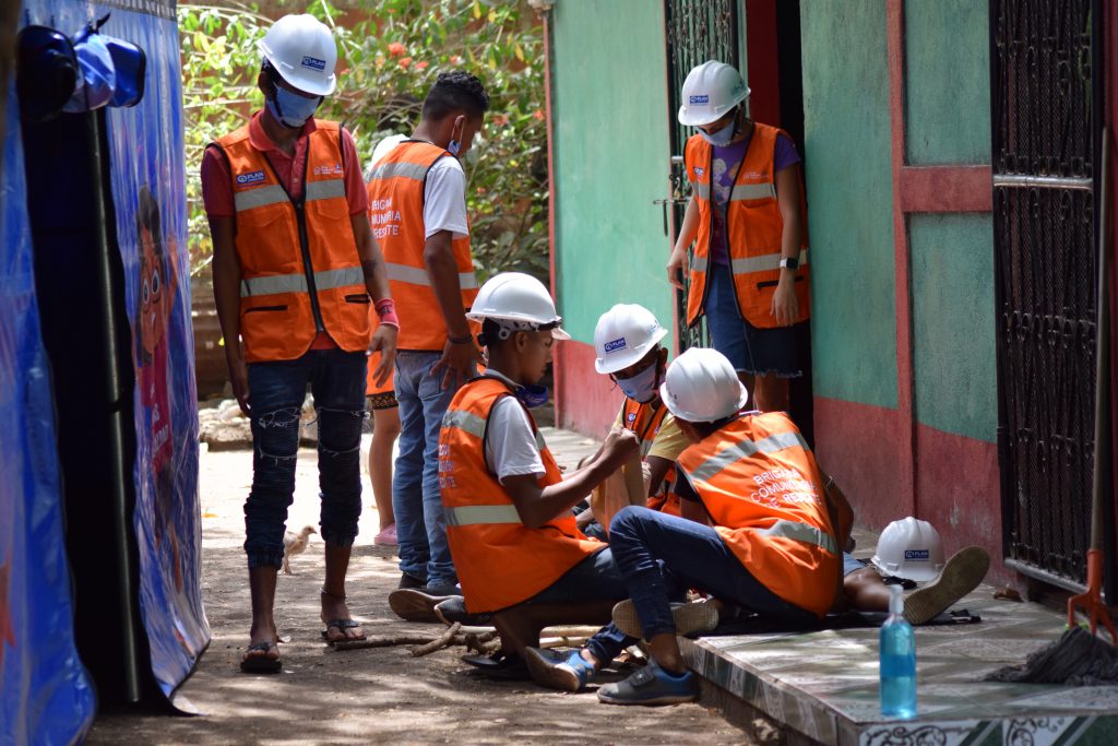 Young brigade members practising first aid techniques.