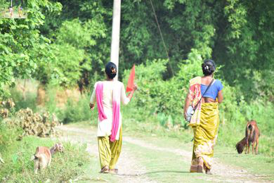 Volunteers use flags and megaphones to disseminate early warning message during flood drill. 