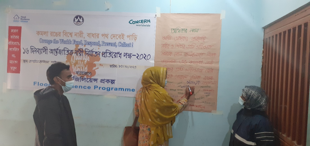 Participants at anti-GBV dialogue in Kapasia Union sign the Pledge Against Gender-based Violence, December 2020.