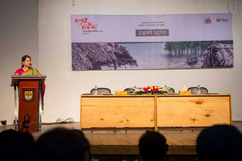 Zakia talking at a photo exhibition opening on Climate Change Adaptation, Dhaka, Bangladesh.